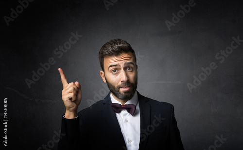 elegant man indicated with finger up