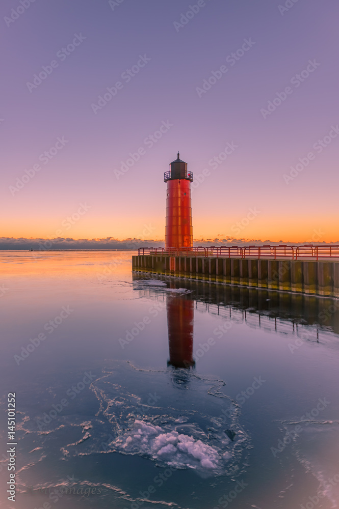 Red Lighthouse at Sunrise on Lake Michigan