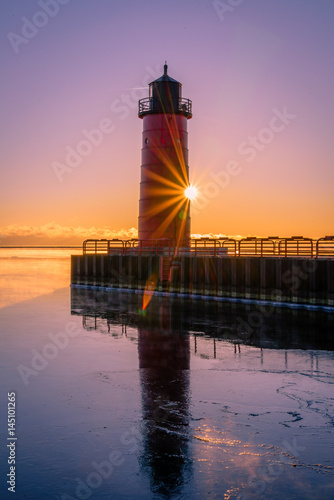 Red Lighthouse with Sunburst Star