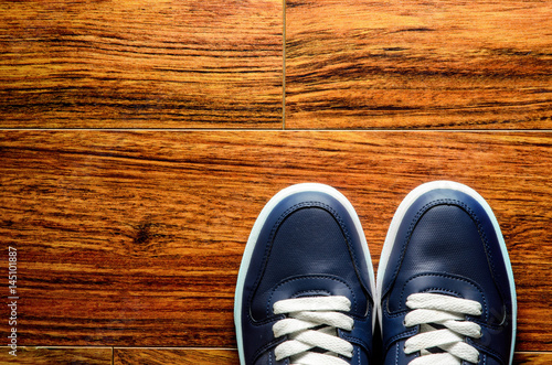 sneakers on wooden floor