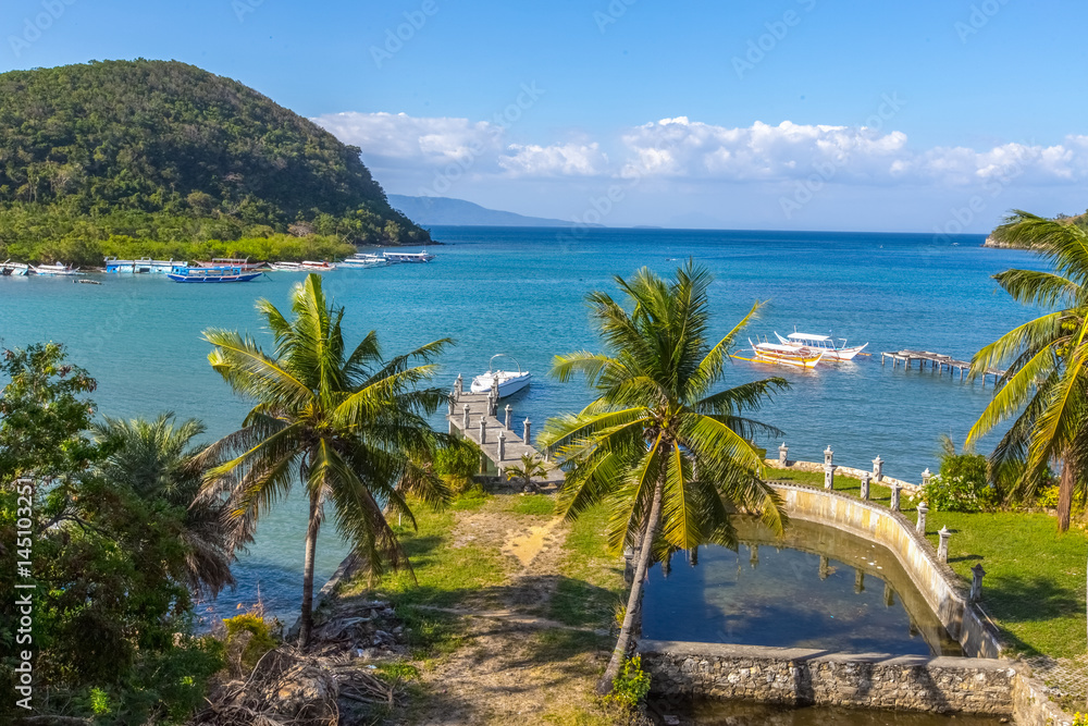 Puerto-Galera, Philippines - March 20, 2017: view on Balatero Cove bay fishermans village and boats