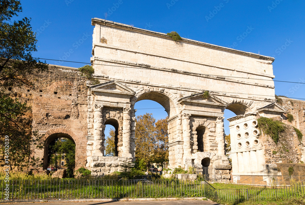 Rome, Italy. The Gate of Porta Maggiore (1st century AD), the tomb of Evrisak - ruins with round holes (1st century BC)