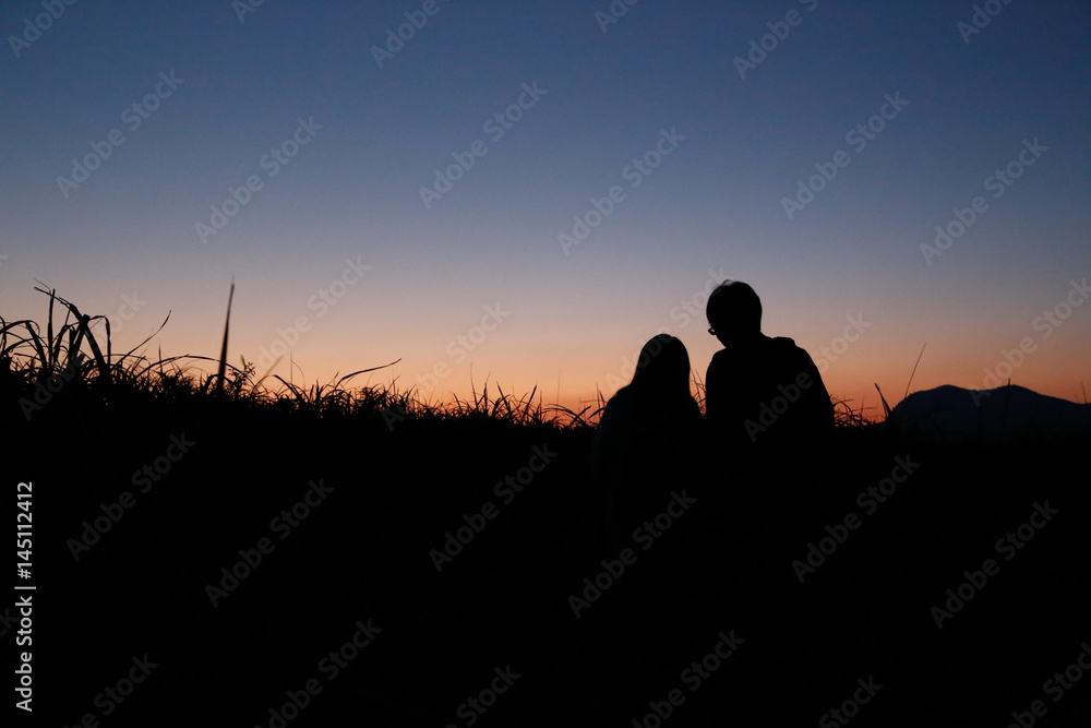 young couple  silhouette mountain