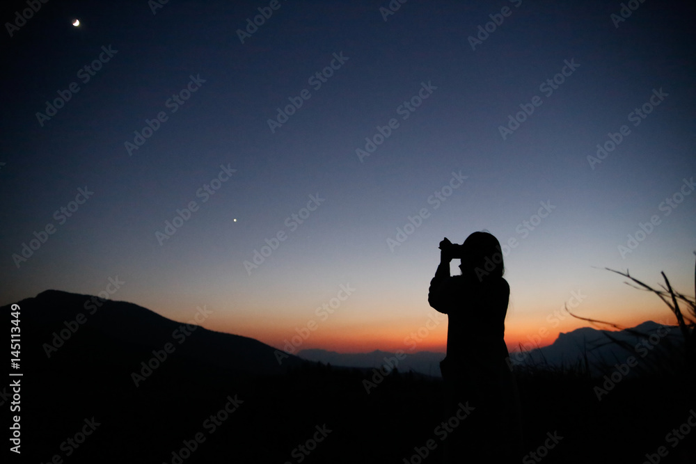 Camera girl at dusk