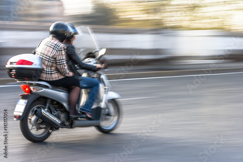Couple on a Scooter (Motion Pan)