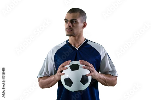 Football player holding football with both hands © wavebreak3