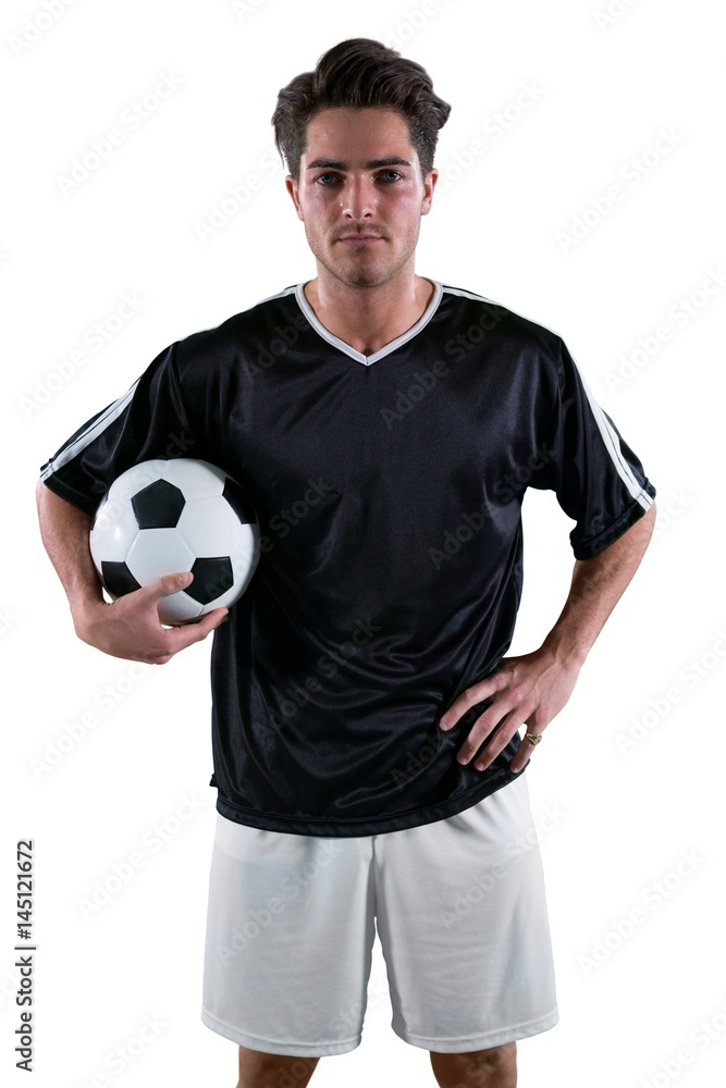 Football player holding a football Football player holding a football