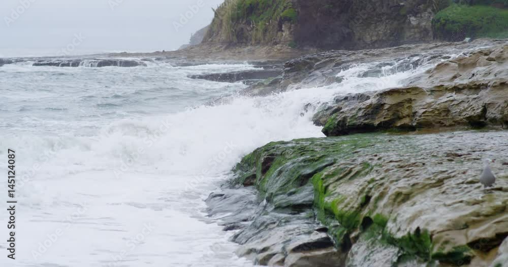 Slow motion shot of waves crashing at Natural Bridges State Beach in Santa Cruz, California. Slow motion shot of waves crashing at Natural Bridges State Beach in Santa Cruz, California.