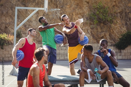 Basketball players taking a selfie