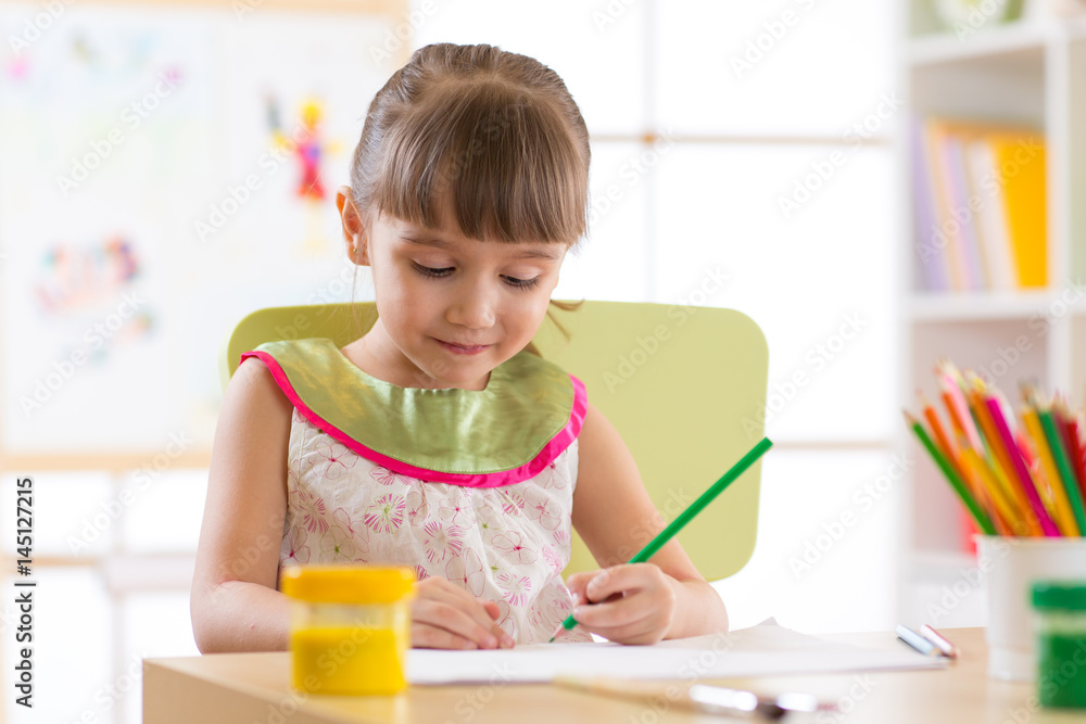 Cute little preschooler child drawing at home Cute little preschooler child drawing at home