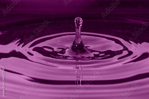 Macro water splash in purple