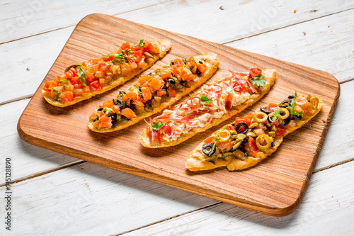 Bruschetta, toasted Italian bread with fresh vegetables.