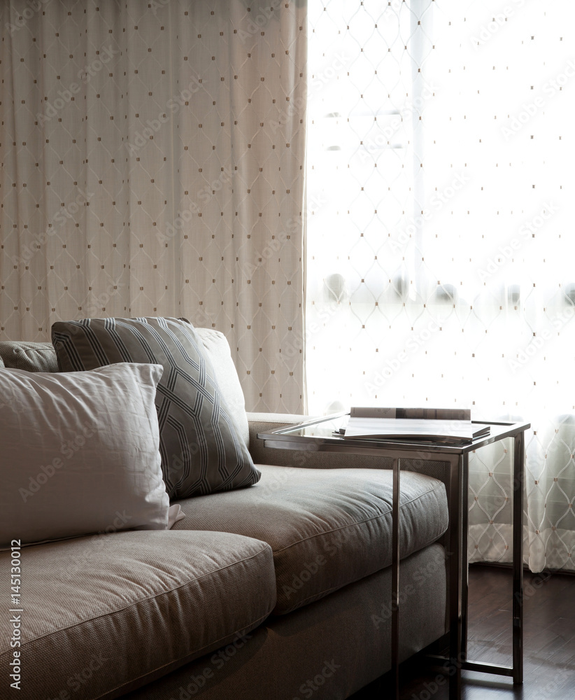 Relax area with large sofa and pillow, selective focus