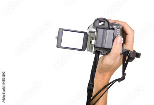 Fotografija Male hand holding a camcorder camera with a cutout for photo isolated on white