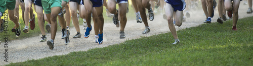 Panoramic view of runners legs and feet in a race