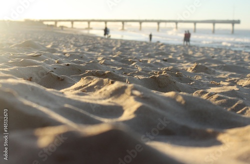 a heavenly beach with shark rock pier in the background