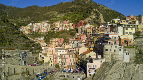 Aerial video footage with drone on Manarola , one of the famous Cinqueterre country, small village with colored houses on the cliff over the sea © immaginario75