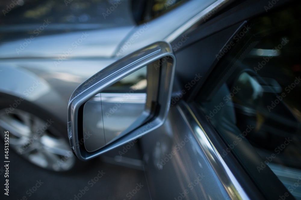 Side mirror of gray car 