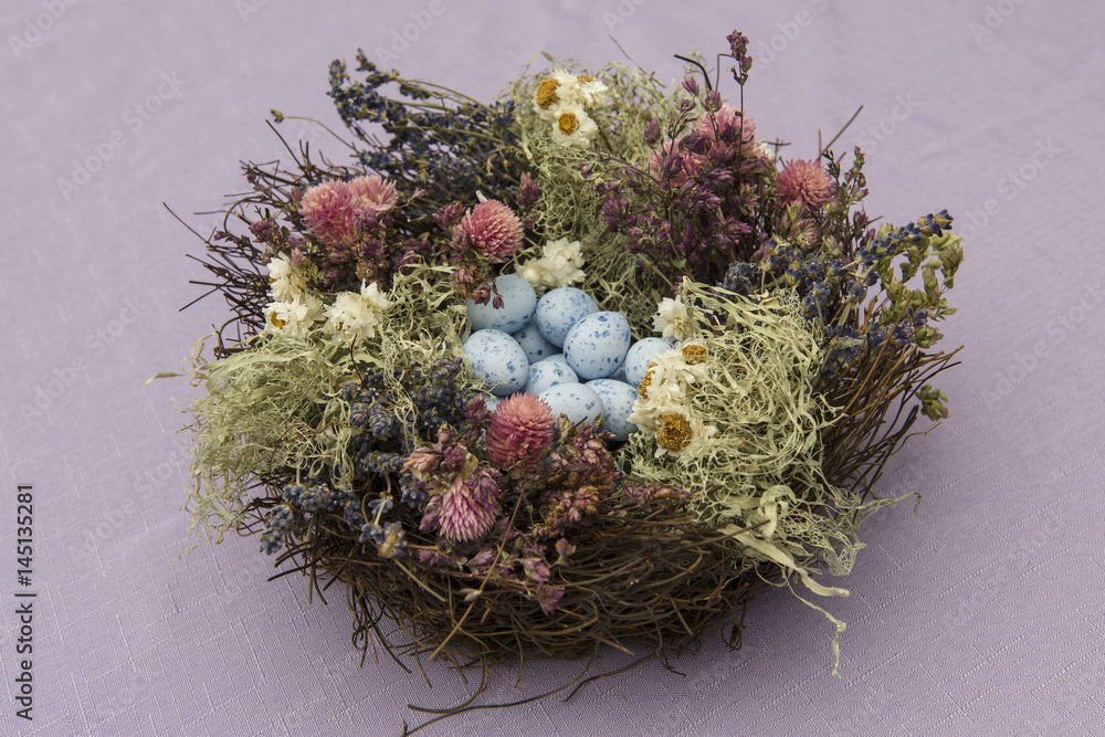 Naklejka premium Easter bird nest with eggs decoration isolated on pink