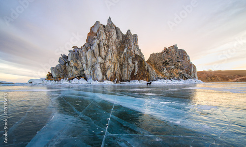 Frozen Lake Baikal at Shamanka rock, Russia photo