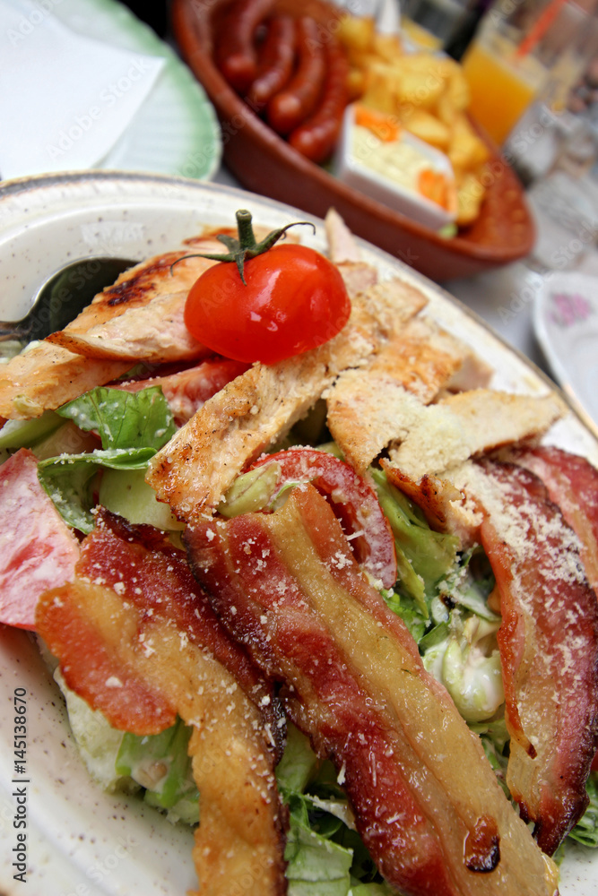Serbian meat food with tomato in a dish Serbian meat food with tomato in a dish