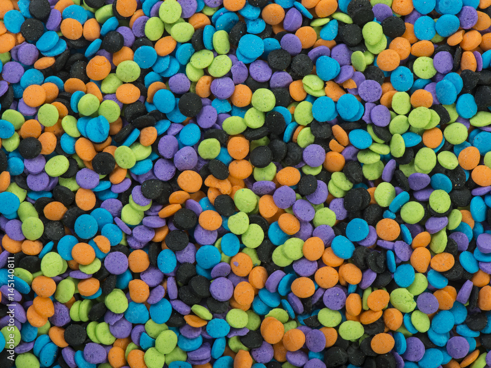 Halloween colored candy sprinkles background texture Halloween colored candy sprinkles background texture