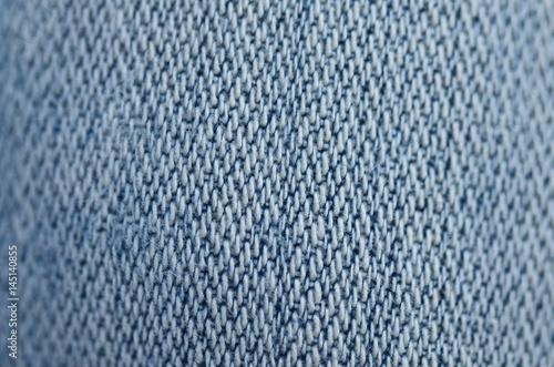 Jeans background texture,Blank real leather jeans label sewed on old worn jeans.
