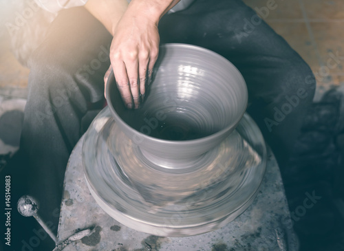 Obraz na płótnie Potter making a clay pot, handmade, selective focus w salonie