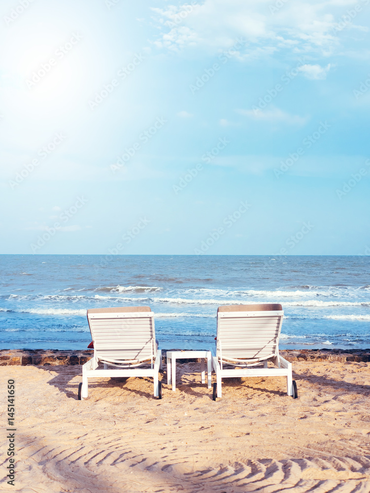 Beach chairs on the sand beach with cloudy blue sky, Relax, vacation time