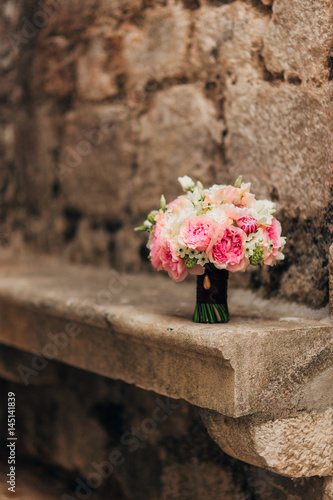 Wedding bouquet on a stone background. Wedding in Montenegro