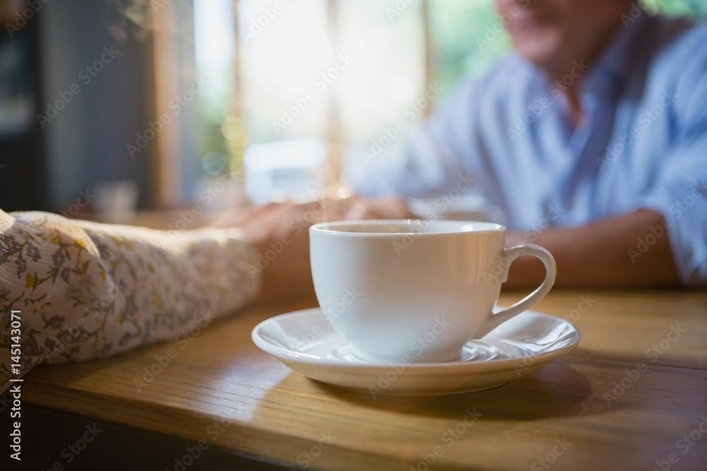 Fototapeta premium Close-up of coffee cup on table