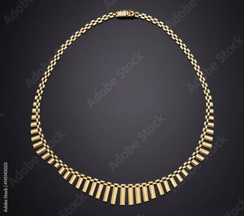 Golden necklace with isolated on black