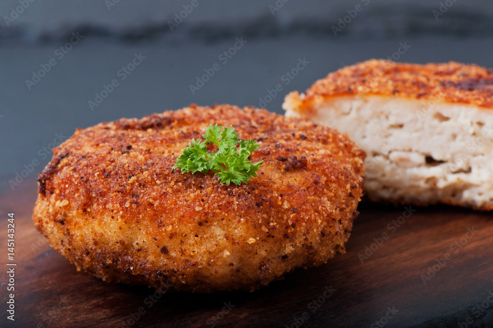 Chicken cutlet on an old wooden background, food. Chicken cutlet on an old wooden background, food.