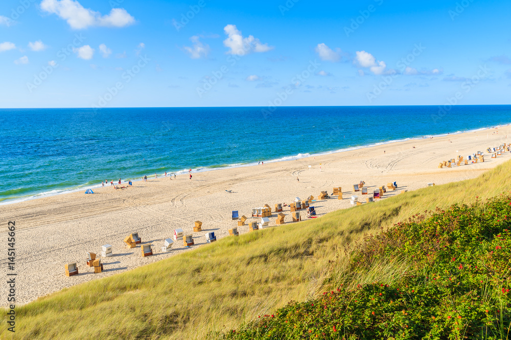 View of white sand beach and sea in Wenningsted coastal village, Sylt island, Germany