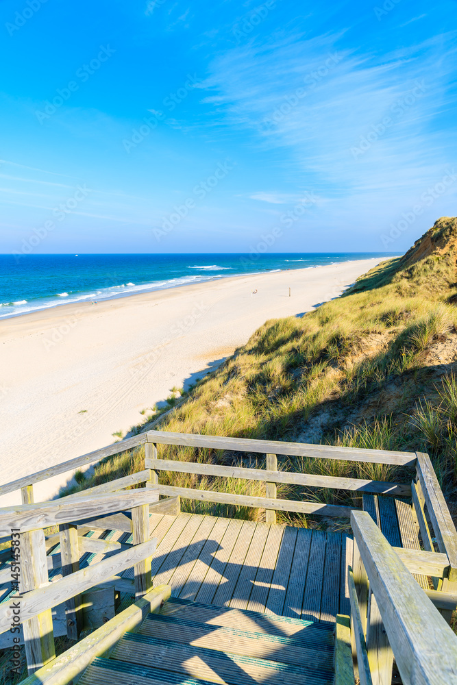 Wooden steps to sandy beach, Sylt island, Germany