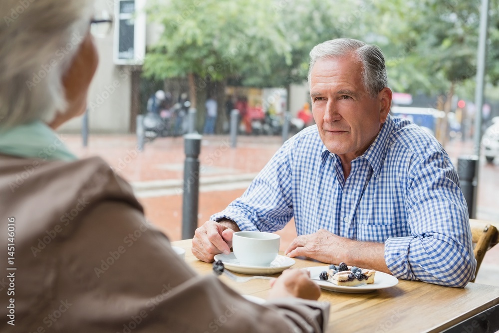 Senior couple sitting with coffee Senior couple sitting with coffee
