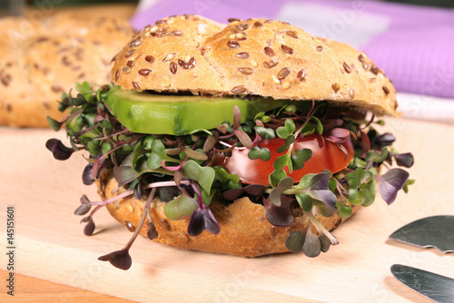 Vegetarian burger with fresh microgreens photo