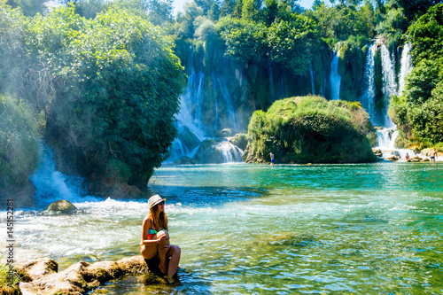 Girl near Kravice Waterfall Bosnia photo