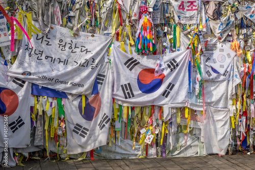 Flags and Buddhist prayer ribbons at the Bridge of Freedom near the Korean demilitarized zone photo