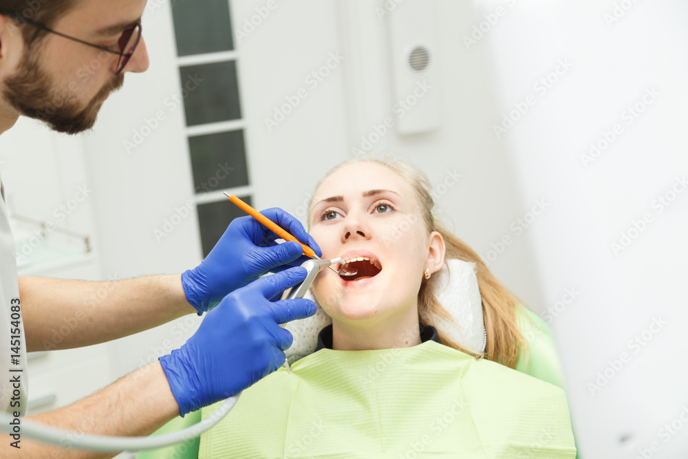 Dentist performs the procedure of dentistry Dentist performs the procedure of dentistry