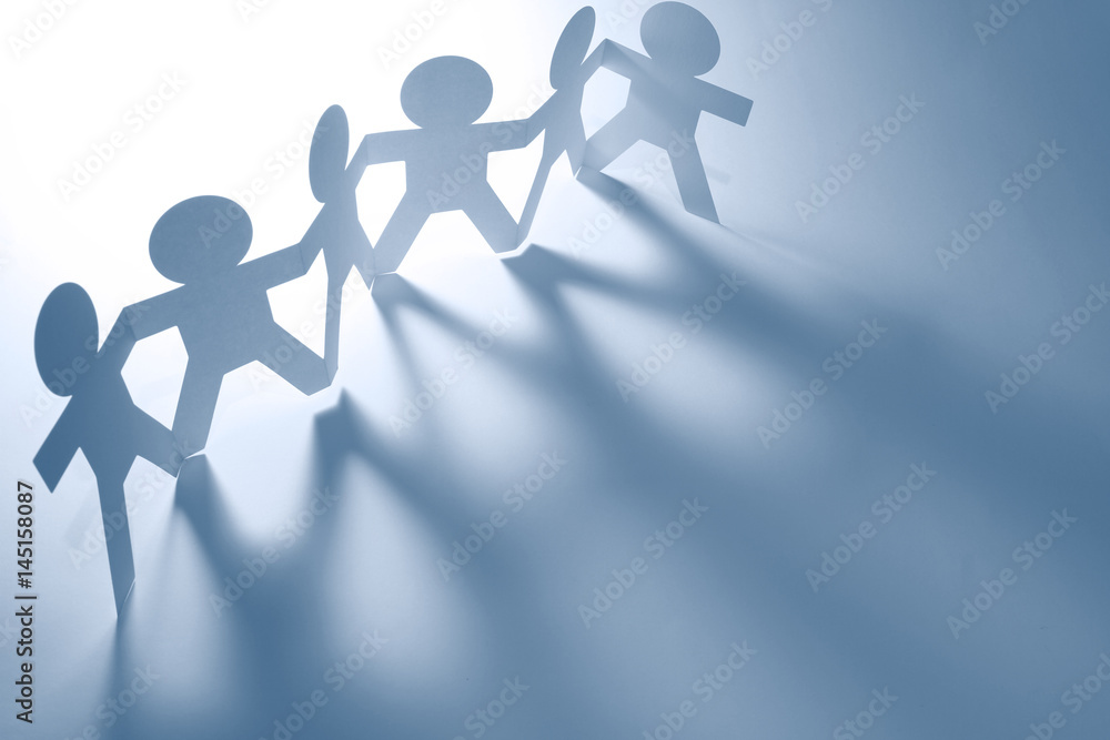 Paper chain team of six people holding hands. Blue tone Paper chain team of six people holding hands. Blue tone