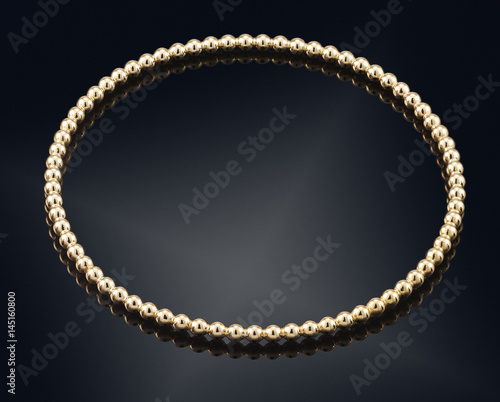 golden bracelet isolated on black