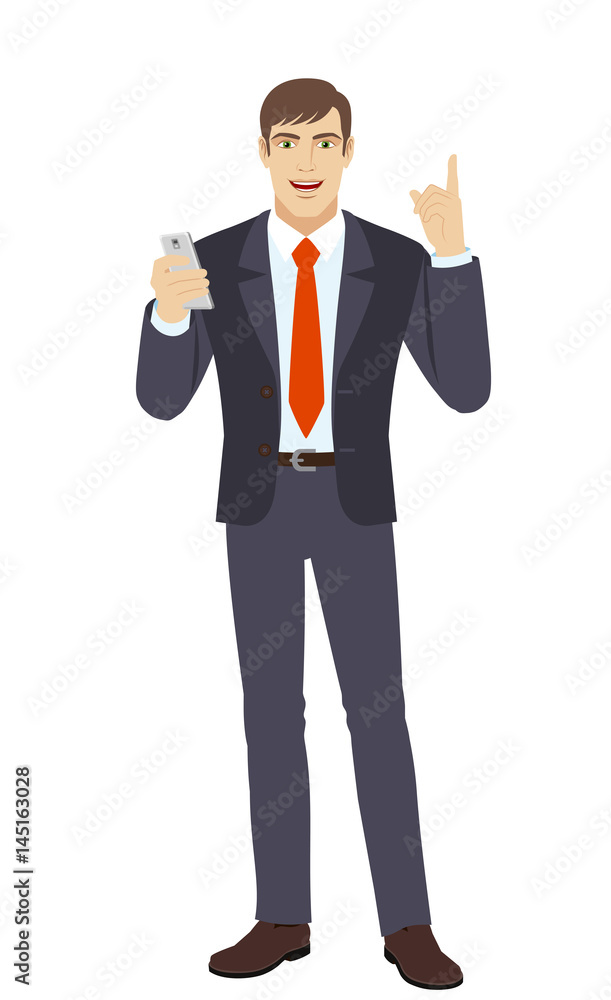 Businessman with mobile phone pointing up Businessman with mobile phone pointing up