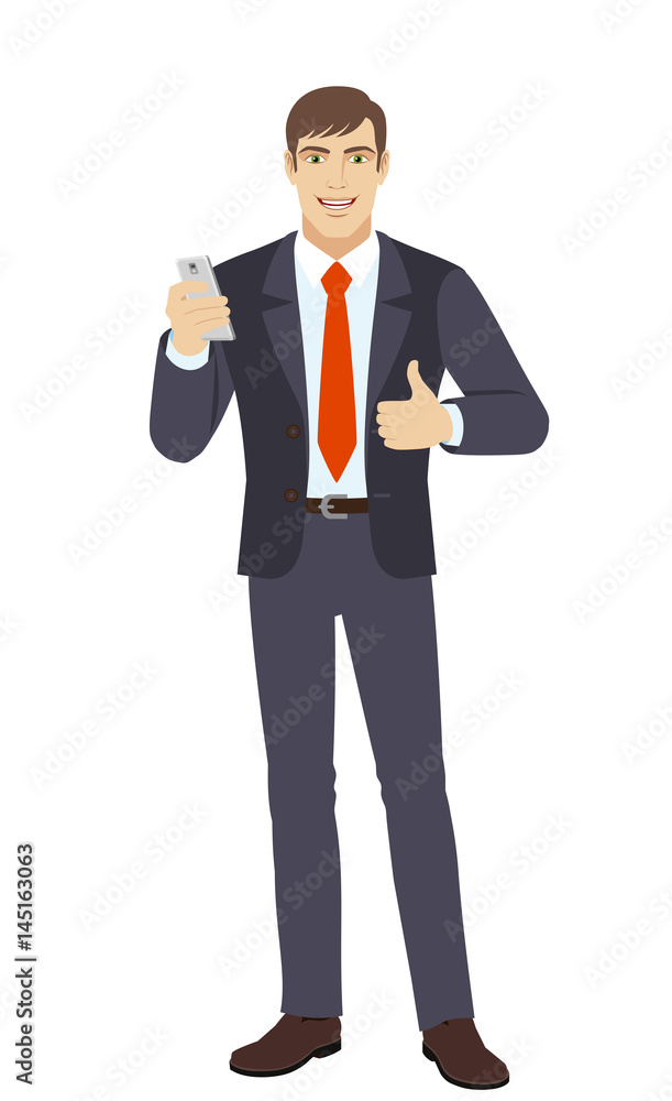 Businessman with mobile phone showing the thumb up Businessman with mobile phone showing the thumb up