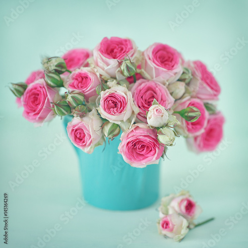 Close-up floral composition with a pink roses .Many beautiful fresh pink roses on a table. 