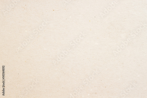 Texture of old organic light cream paper, background for design with copy space text or image. Recyclable material, Natural rough, has small inclusions of cellulose