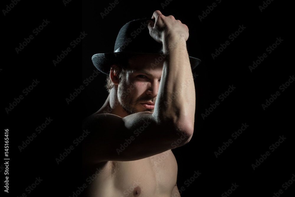 man put on his hat. Men's fashion, headpiece. Mysterious sexy guy. Detective man put on his hat. Men's fashion, headpiece. Mysterious sexy guy. Detective