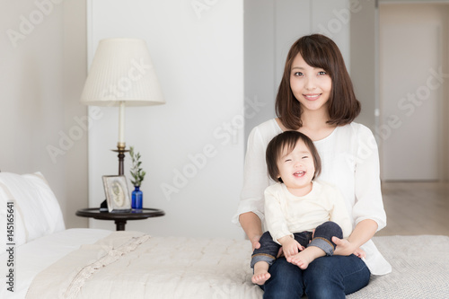 portrait of asian family in bedroom