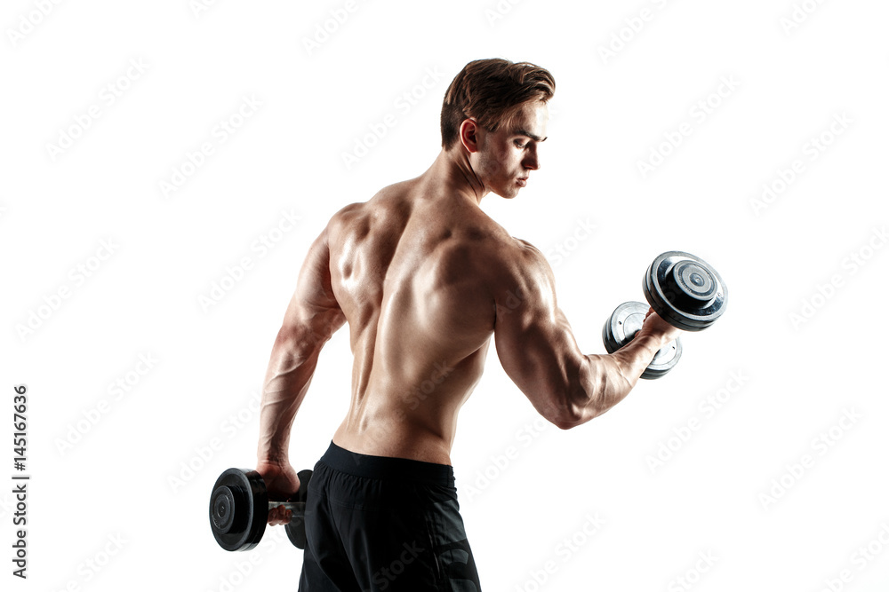 Muscular bodybuilder guy doing exercises with dumbbells over white background Muscular bodybuilder guy doing exercises with dumbbells over white background