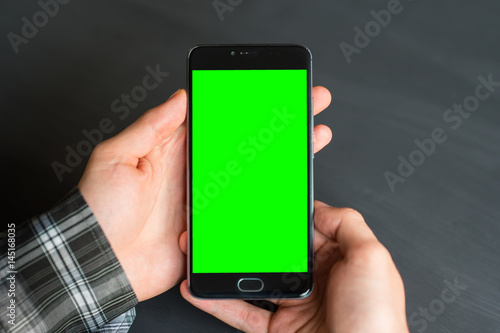 Business man using smart phone with green screen for internet and email. Sequence Concepts of using mobile technologies and smarfon in mobile applications